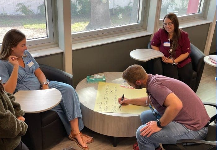 Educators exchange ideas about building productive mentoring relationships with student teachers.