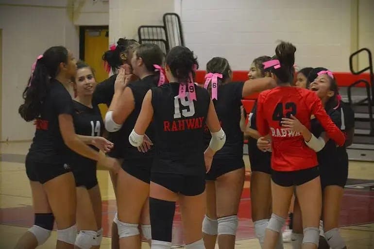 Rahway players celebrate during a match supporting breast cancer awareness and the Side-Out Foundation.